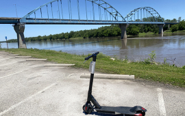 photo of a motorized scooter in front of Leavenworth bridge