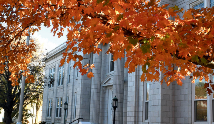 page 1 of newsletter shows Leavenworth City Hall with tree with orange leaves